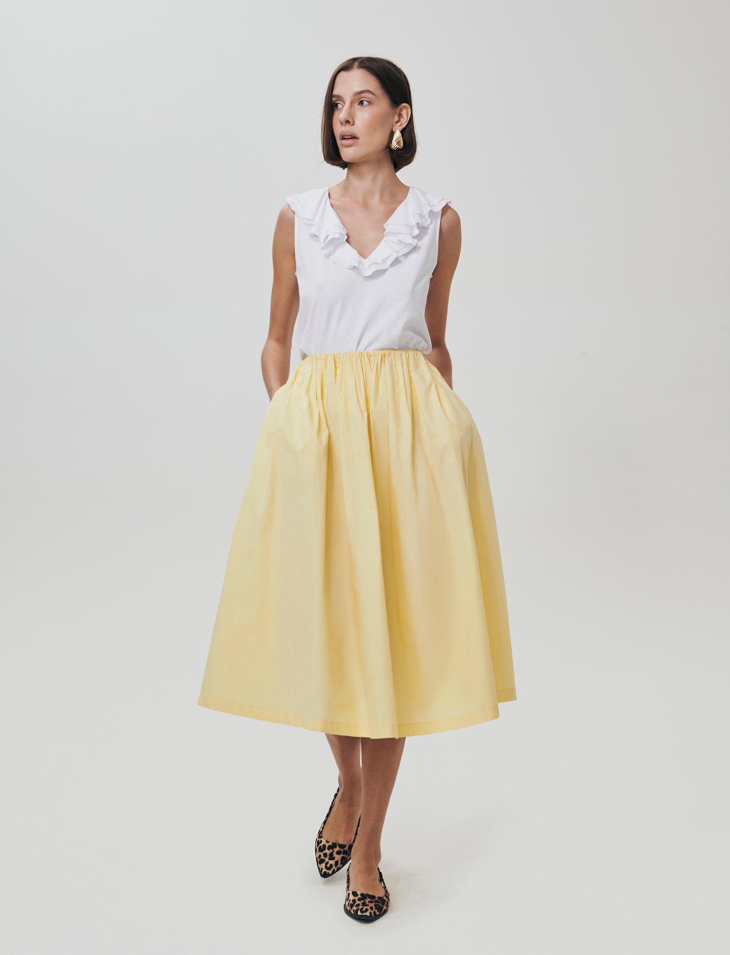 Introducing a long skirt designed for the modern woman, blending comfort and style effortlessly. Fea - Yellow