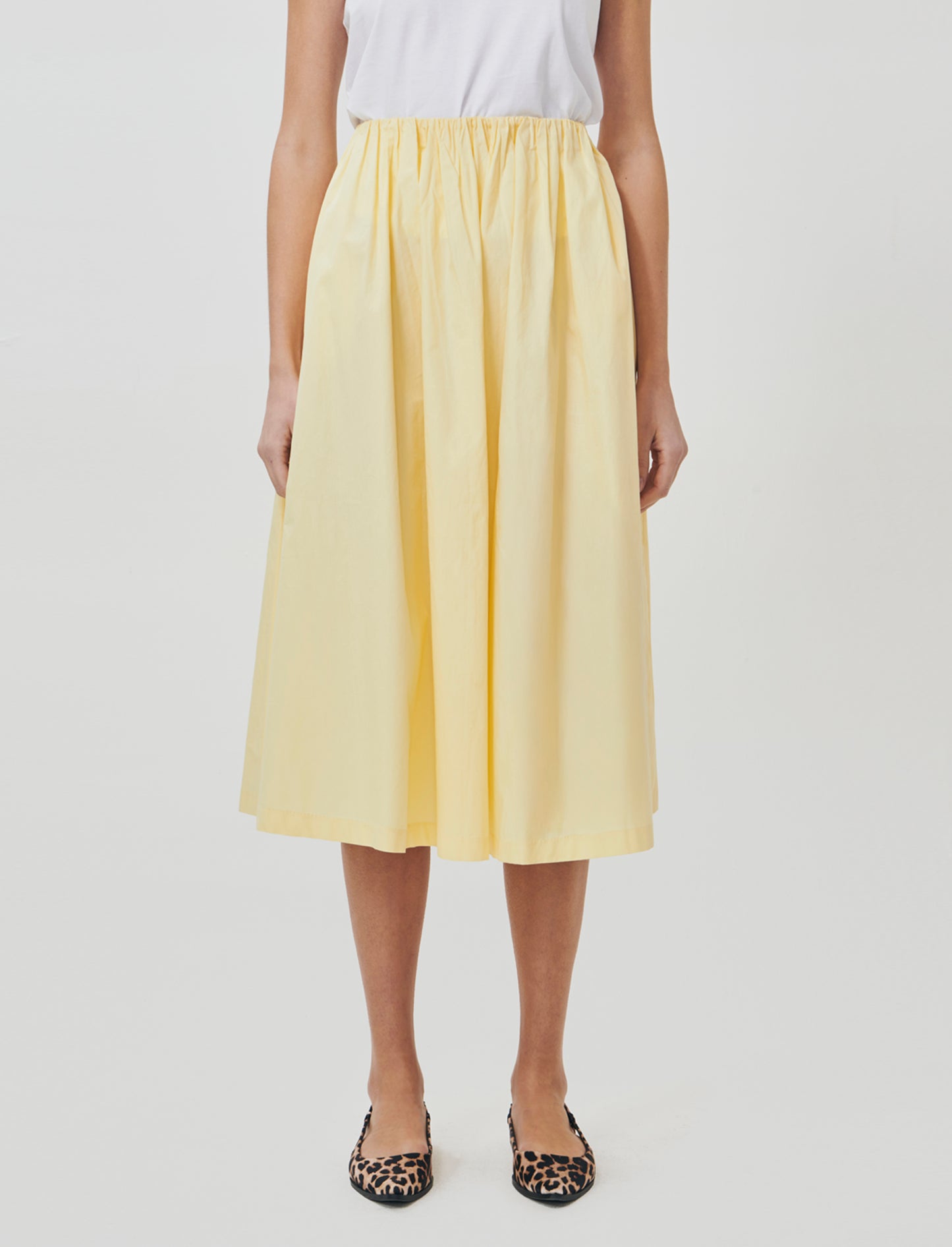 Introducing a long skirt designed for the modern woman, blending comfort and style effortlessly. Fea - Yellow