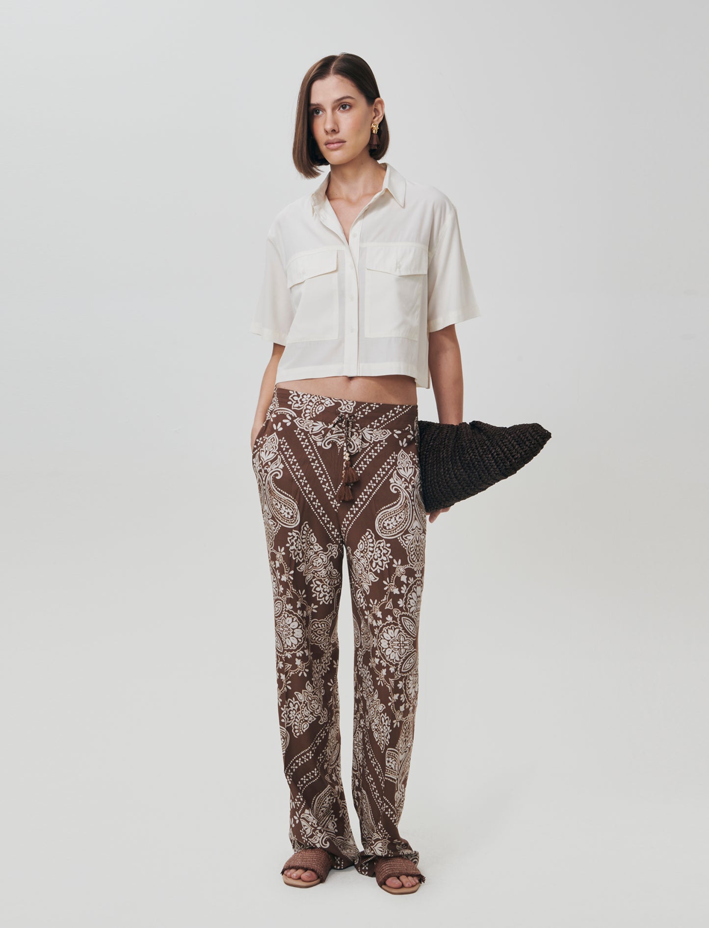 Introducing our versatile women's pants featuring a comfortable elastic waistband and a practical dr - 