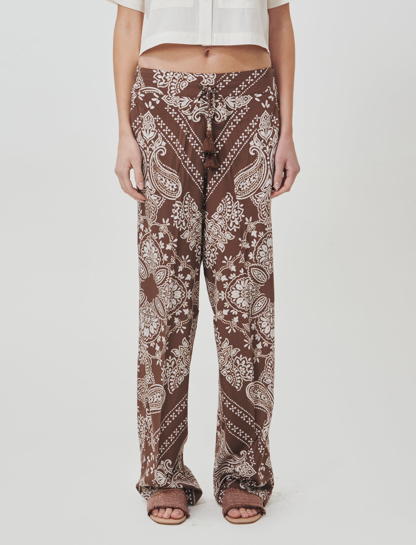 Introducing our versatile women's pants featuring a comfortable elastic waistband and a practical dr - 