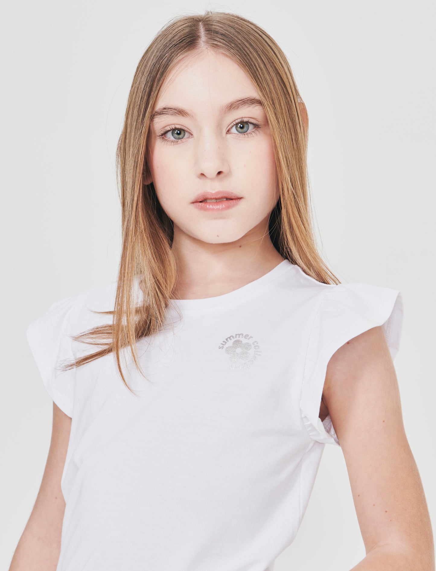 T-shirt mezza manica con volant e stampa lucida - Bianco