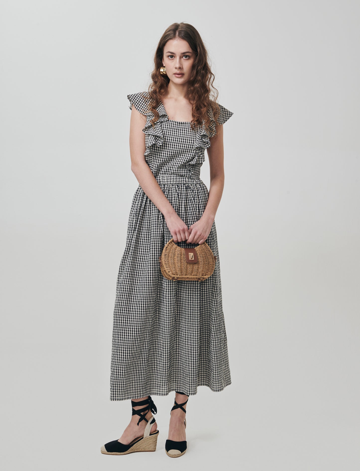 Introducing the Vichy-printed long skirt, a stylish and versatile addition to any woman's wardrobe. - Black