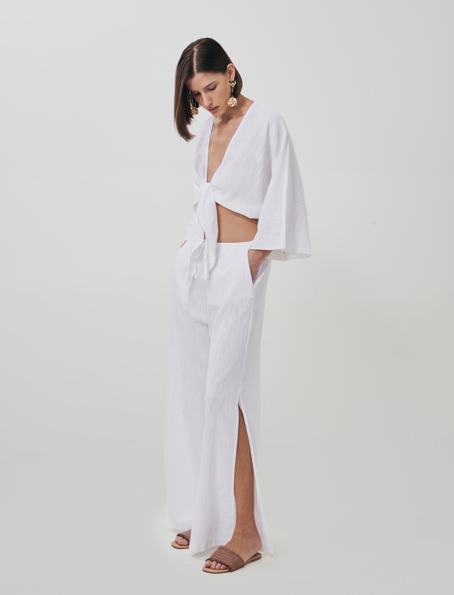 Introducing the perfect blend of comfort and style: wide-leg pants designed specifically for women. - White