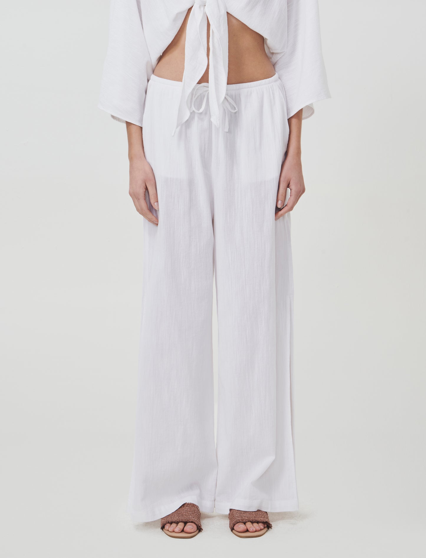 Introducing the perfect blend of comfort and style: wide-leg pants designed specifically for women. - White