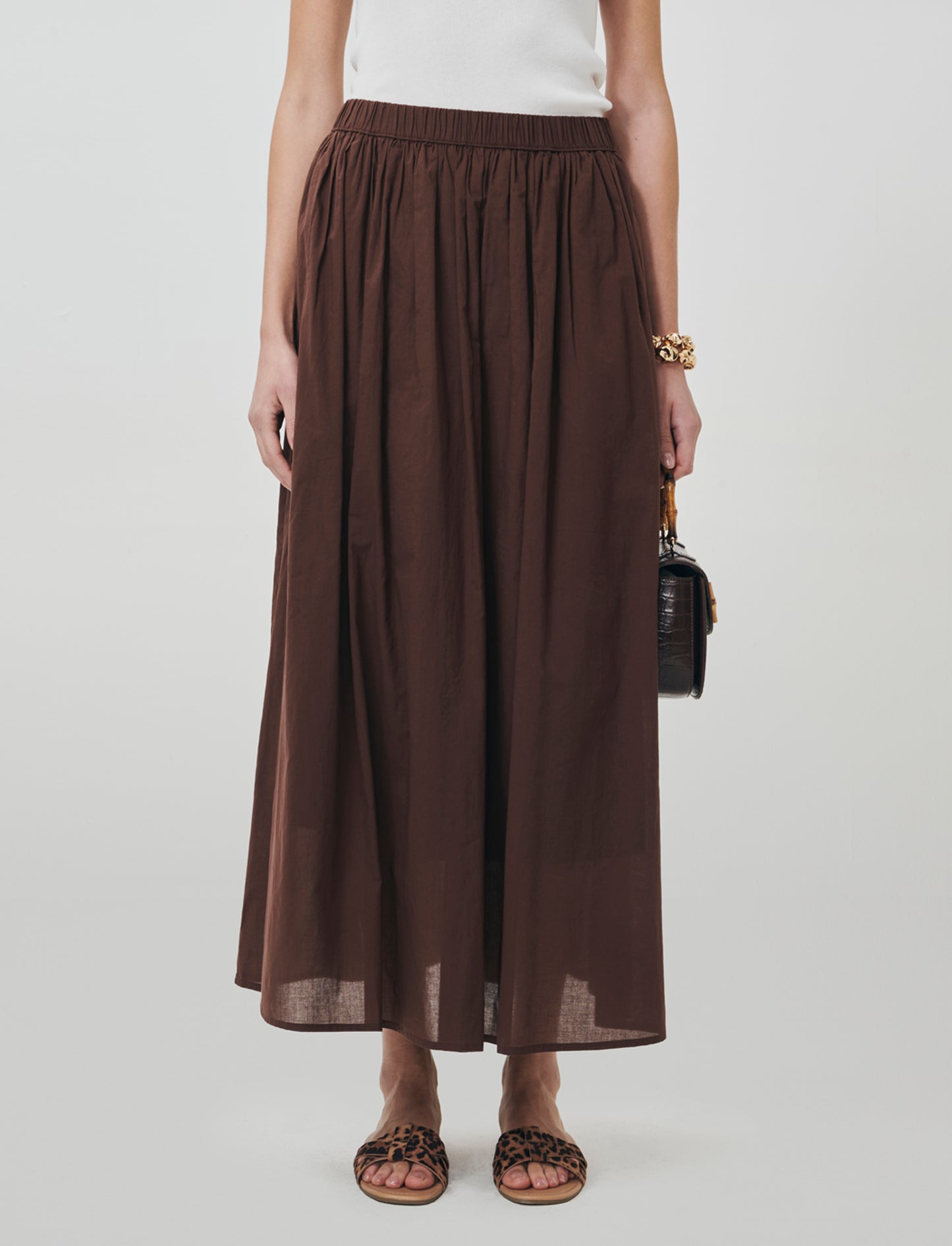 Introducing a long cotton skirt designed for ultimate comfort and style. This piece features a relax - Brown