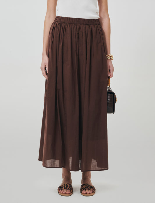 Introducing a long cotton skirt designed for ultimate comfort and style. This piece features a relax - Brown