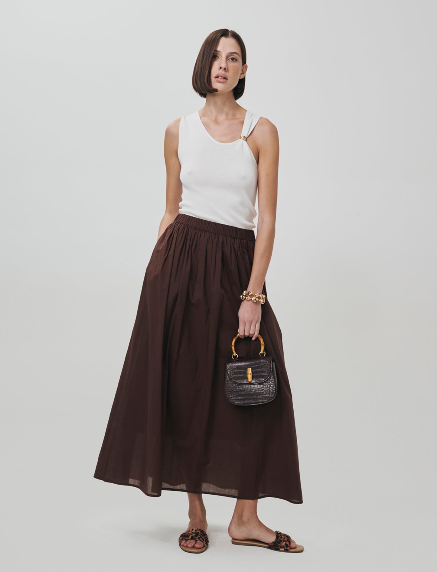 Introducing a long cotton skirt designed for ultimate comfort and style. This piece features a relax - Brown