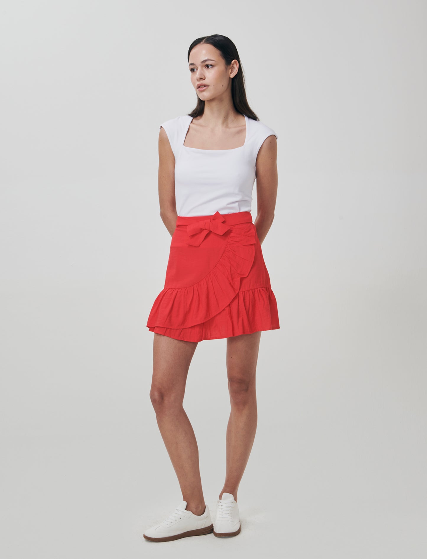 Short skirt with ruffles and bow in front - Orange