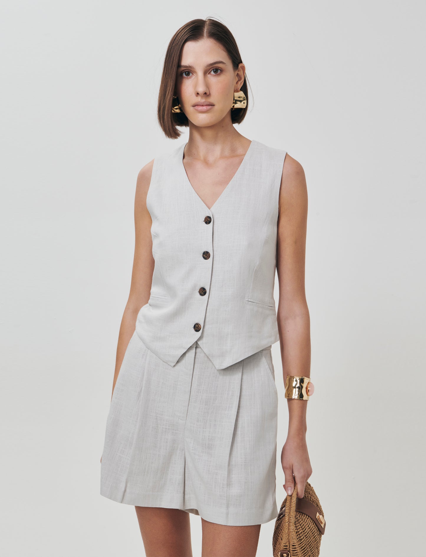 Gilet con tasche a taglio davanti - Sabbia