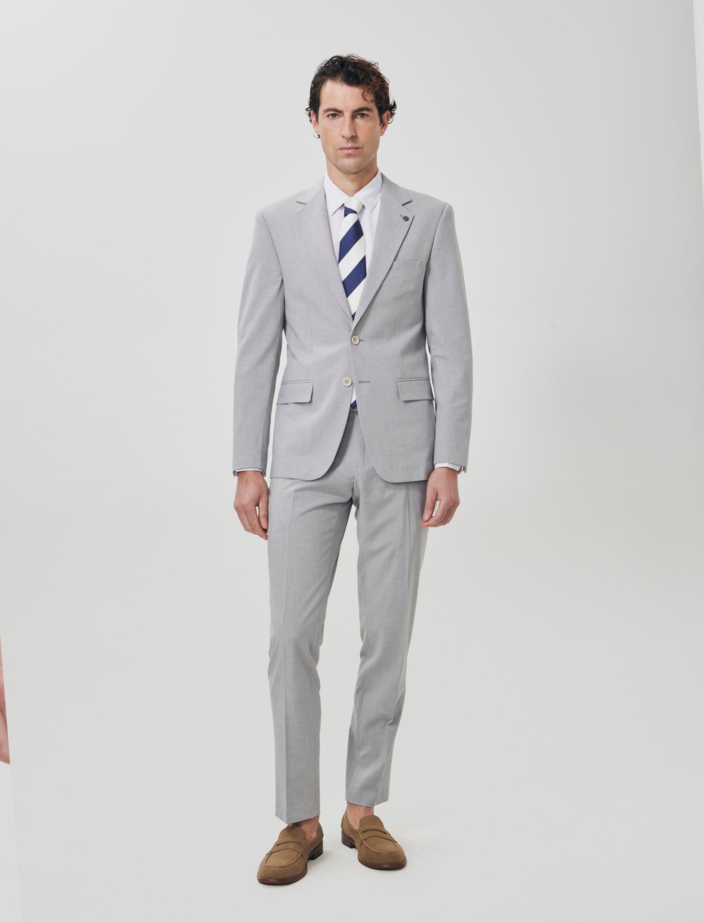 "Blazer formal fit micro structure melange in English translates to:

Formal fit blazer with micro m - Grey