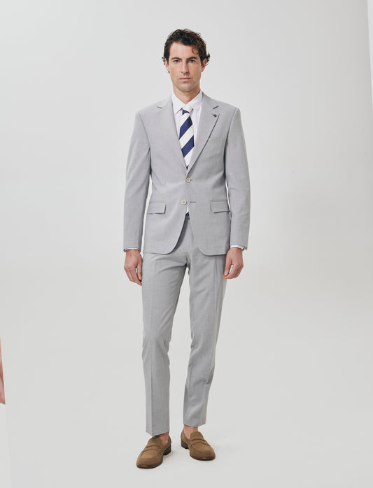 "Blazer formal fit micro structure melange in English translates to:

Formal fit blazer with micro m - Grey