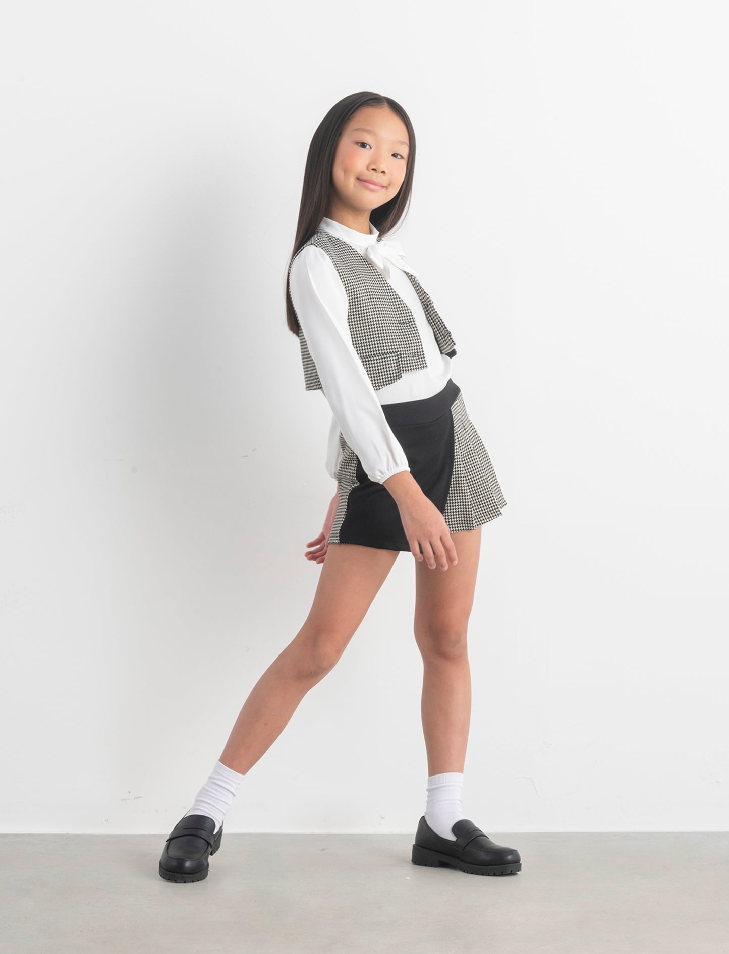 Short in pied de poule con pannello a contrasto. - Fantasia