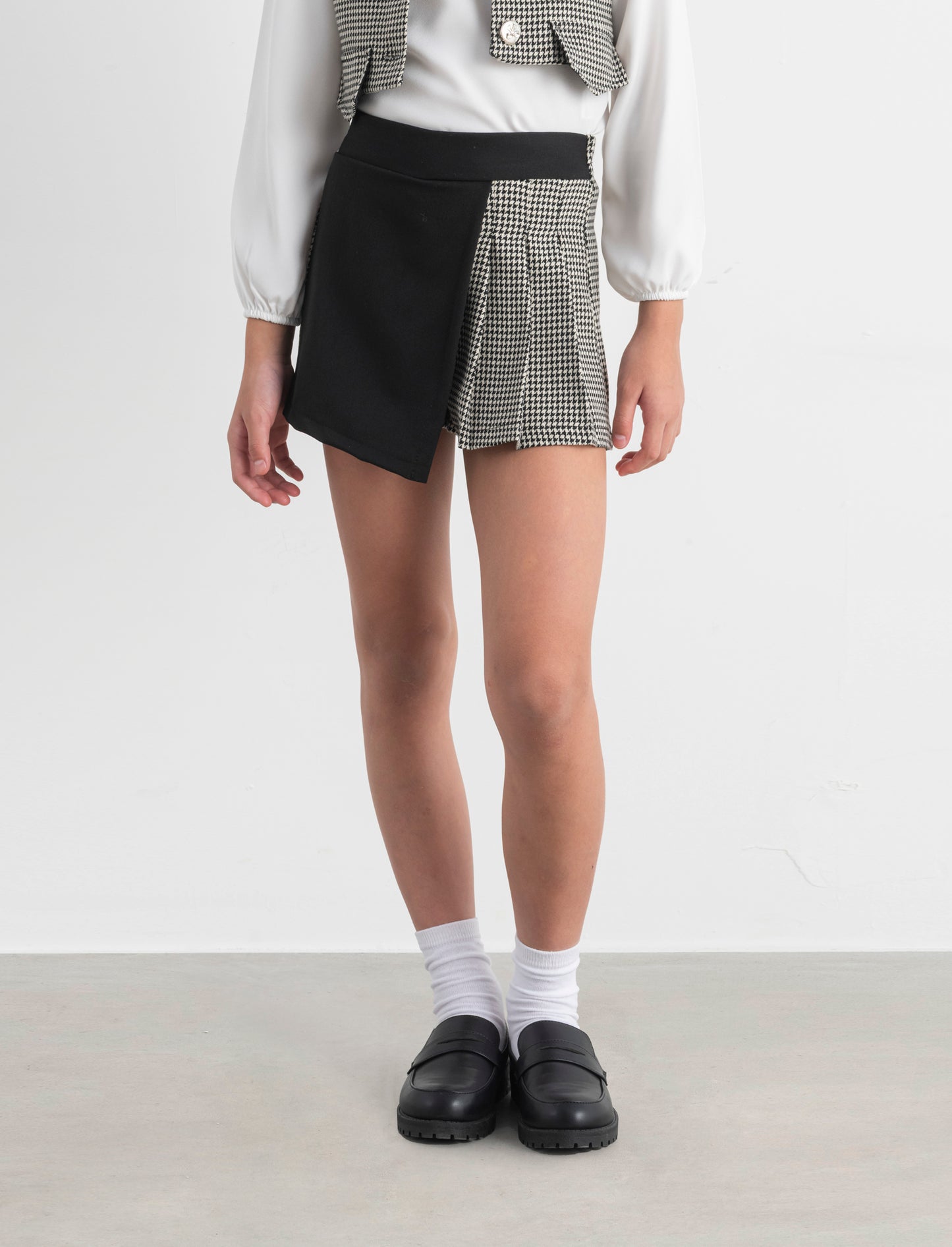 Short in pied de poule con pannello a contrasto. - Fantasia