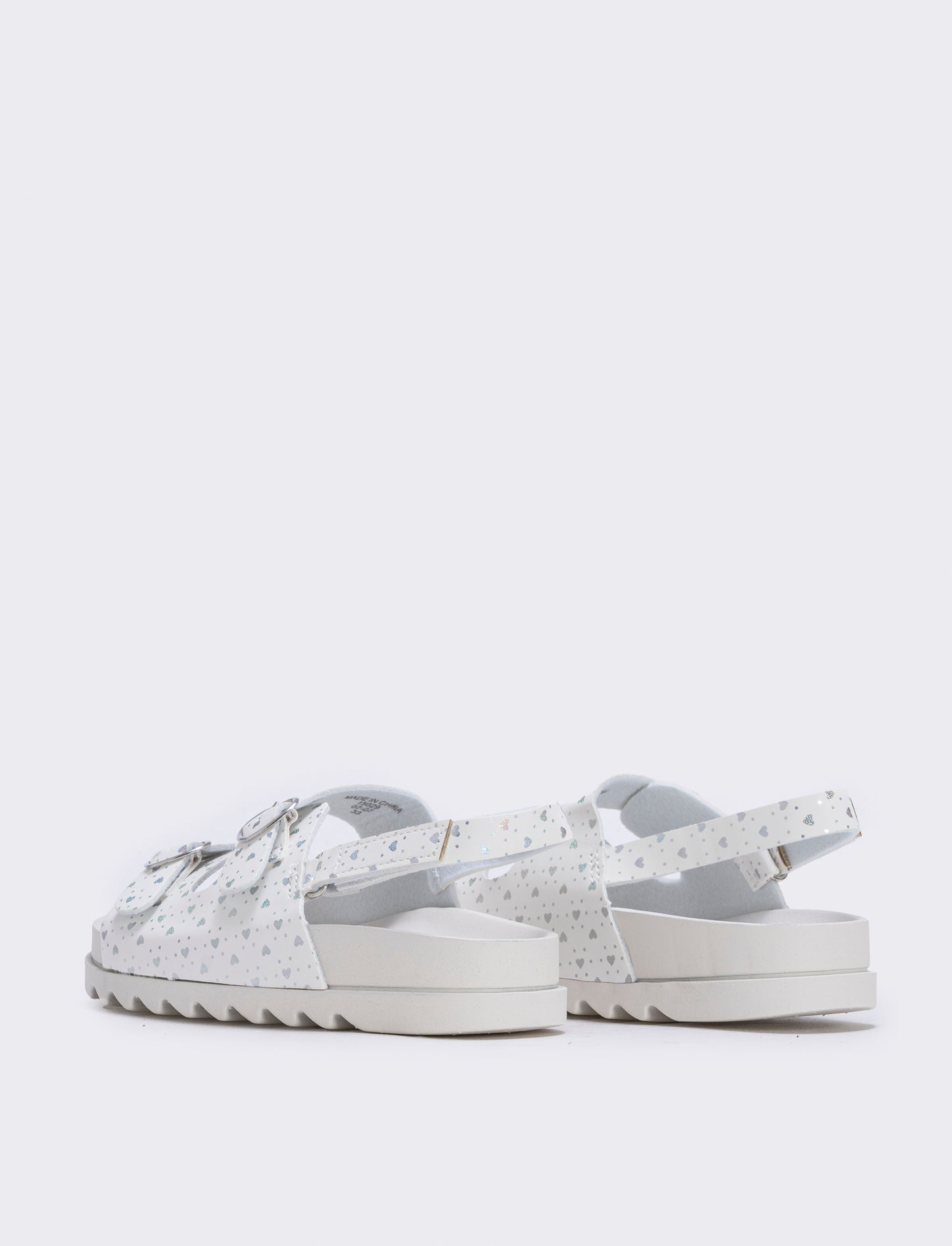 Sandalo con fibbie a cuore da bambina. - Bianco