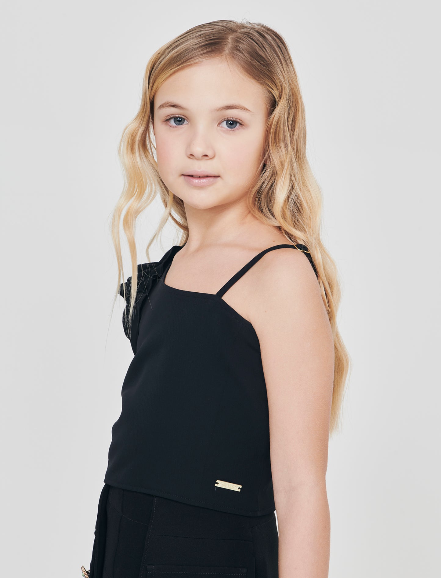 Top cropped monospalla elegante con rouches - Nero
