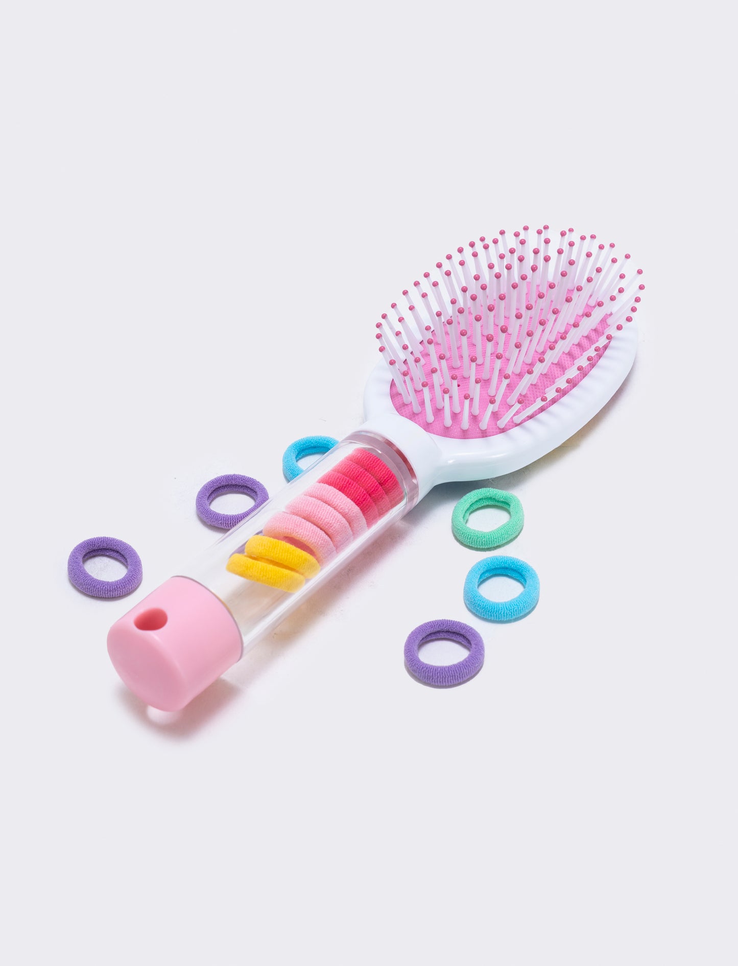 Brush with integrated tube and elastics - Multicolor