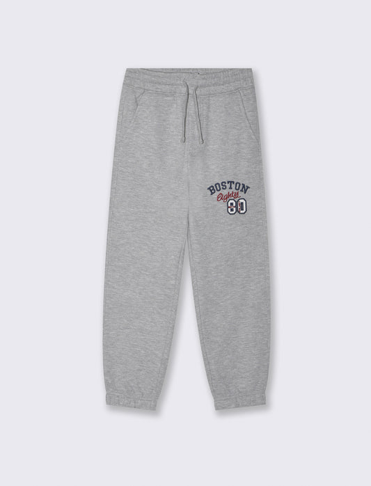 Jogger con ricamo e coulisse in vita - Grigio mel.