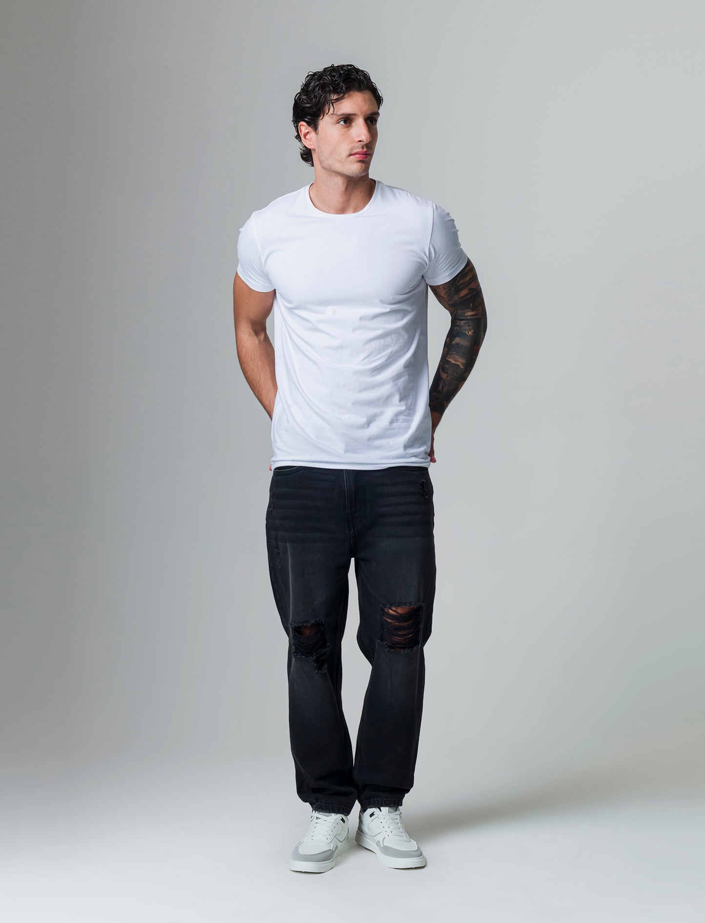 Jeans nero loose fit con strappi da uomo - Nero