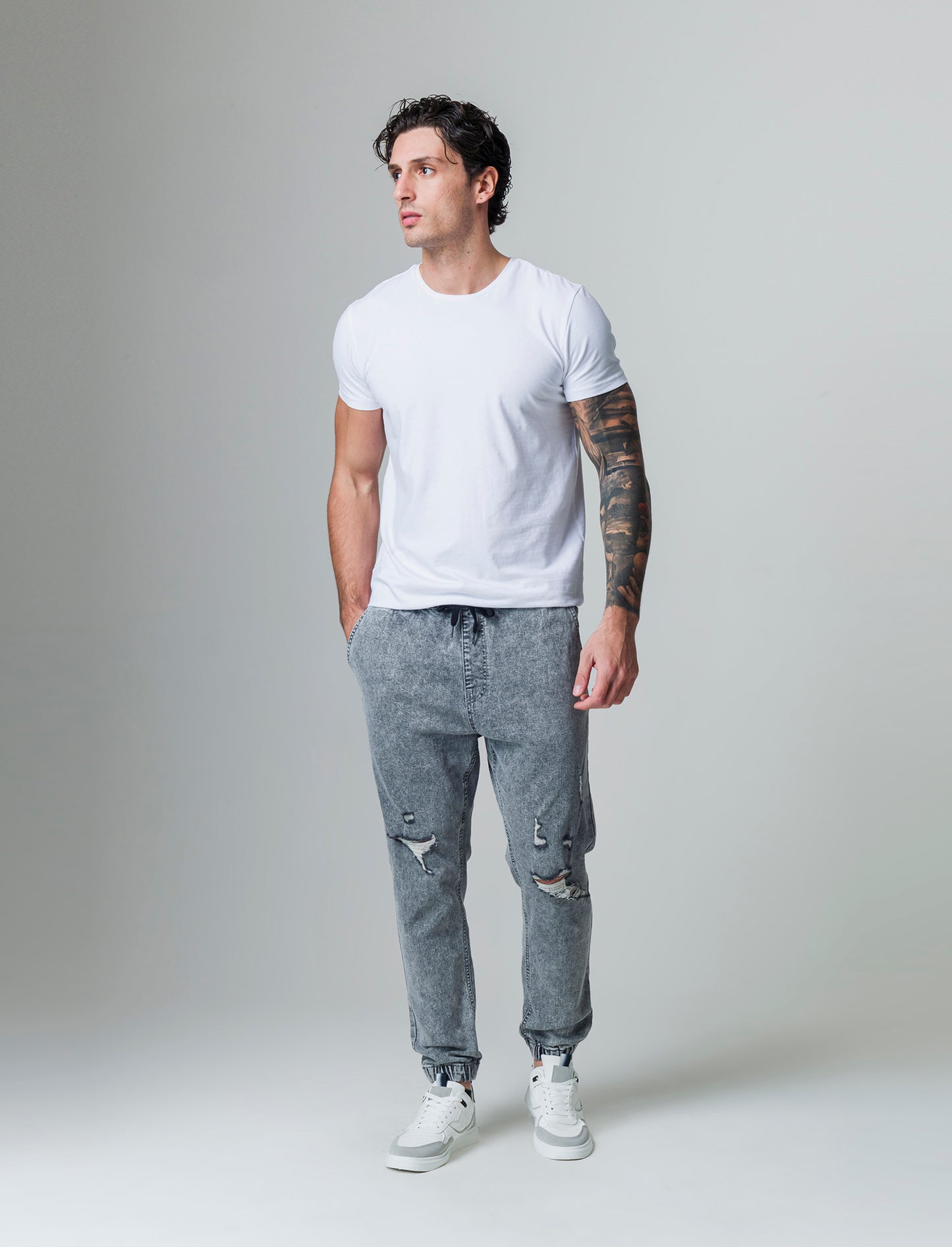 Jeans denim grigio con vita jogger e strappi da uomo - Grigio