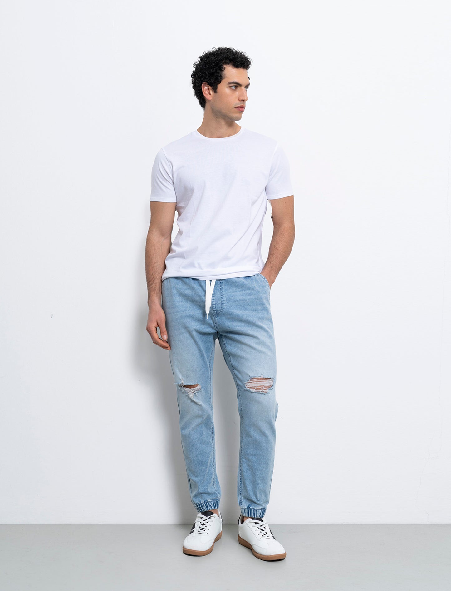 Jeans denim medio con vita jogger e strappi da uomo - Denim