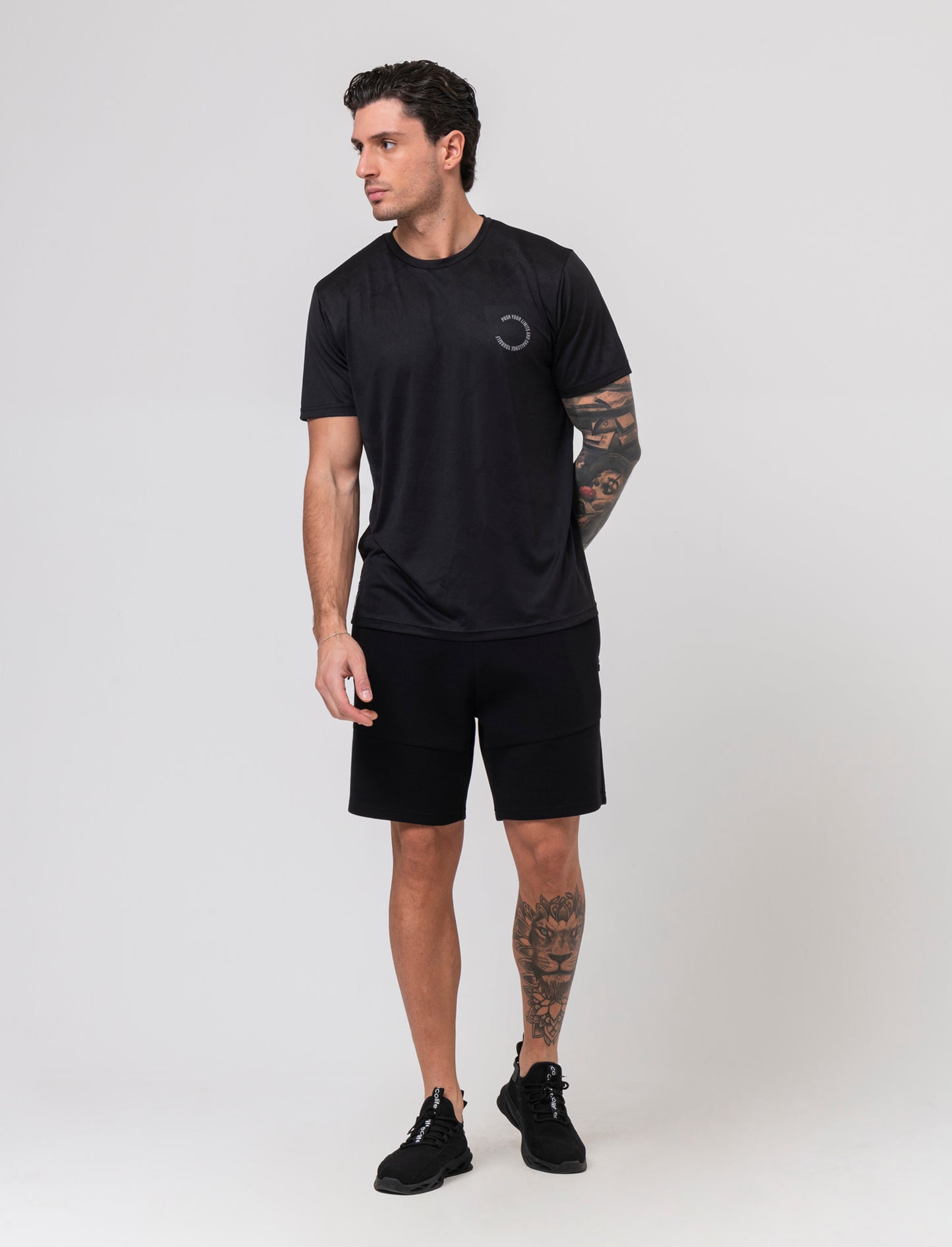 Bermuda sportivi in tessuto tecnico accoppiato da uomo - Nero