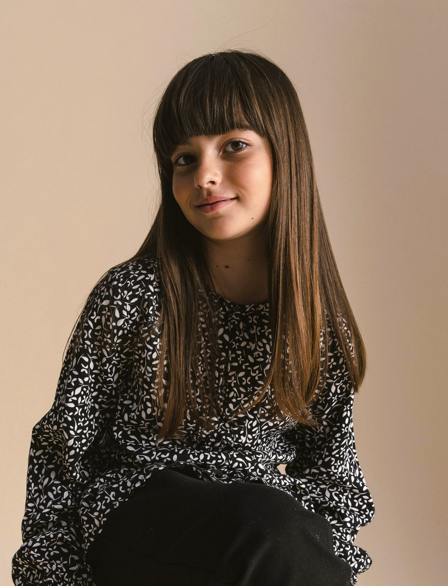Blusa stampata da bambina. - Nero