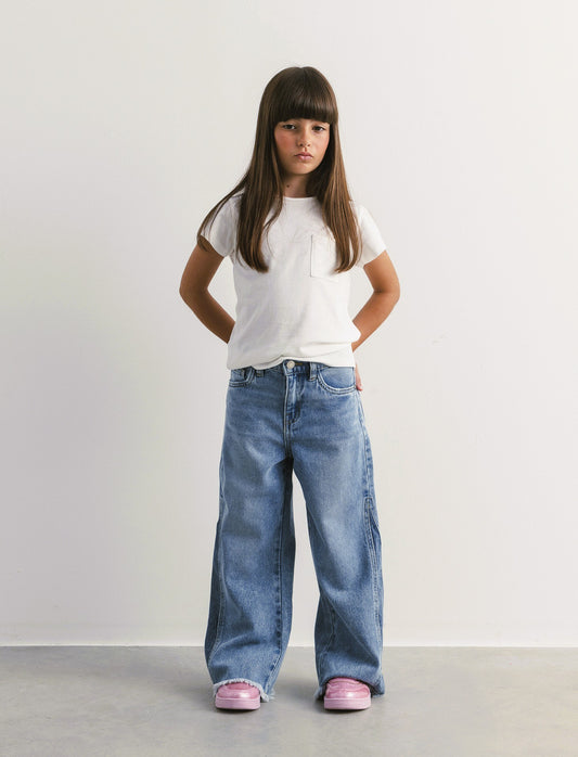 Jeans gamba larga da bambina con inserto laterale. - Denim