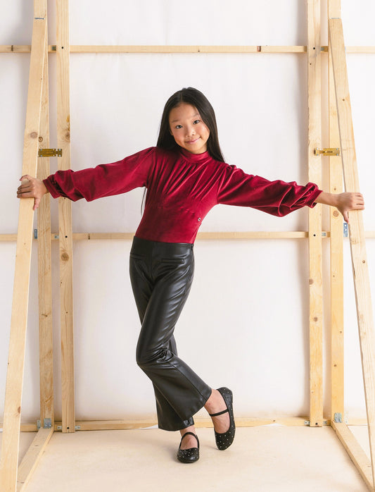 Leggings modello flare in finta pelle. - Nero