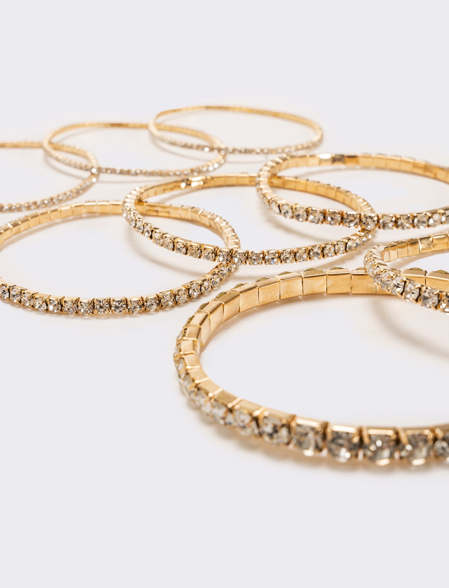 8 bracciali elastici con strass - Oro