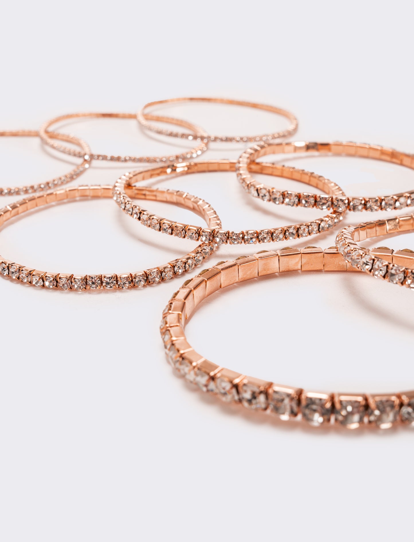 8 bracciali elastici con strass - Oro rosa