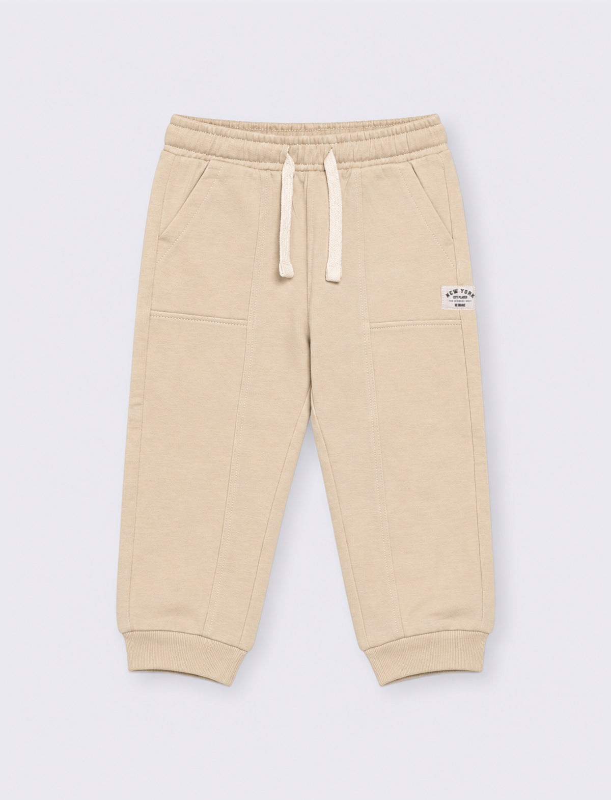 Jogger con tagli ed etichetta - Beige