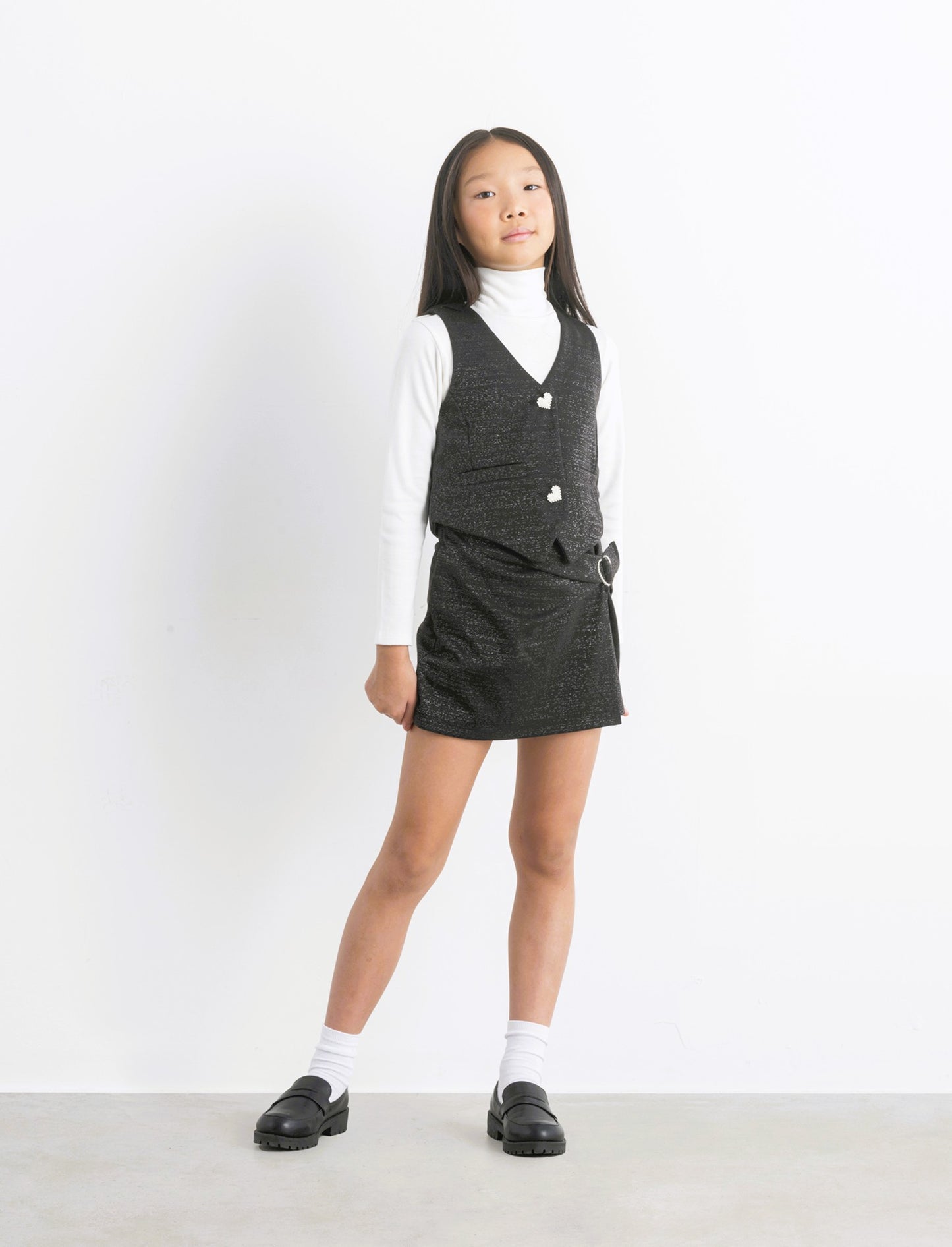 Gilet da bambina con bottoni gioiello. - Nero