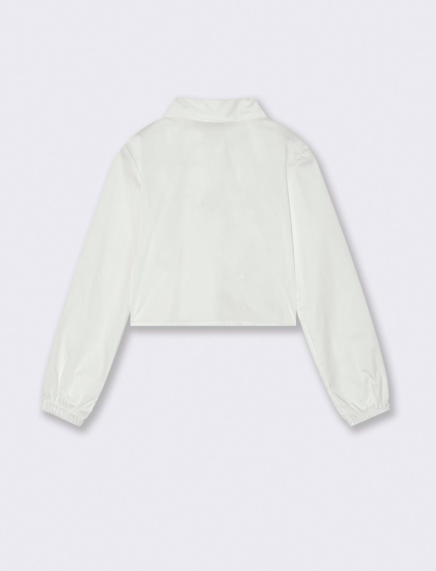 Camicia manica lunga cropped da bambina con stampa brillante. - Bianco